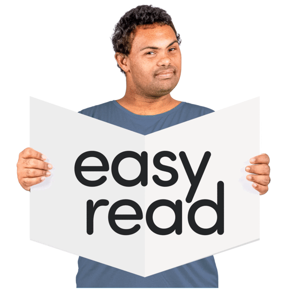 man holding sign that says 'easy read'